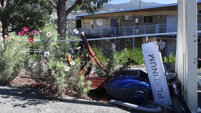 Rubbish in the garden at Windsor Court in Glenorchy. Picture: LUKE BOWDEN