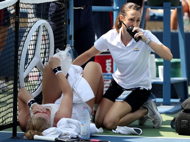 Julia Glushko of Israel receives treatment on the court during her women's singles first round match against Monica Niculescu of Romania. Picture: Getty Images