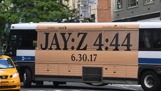 A New York City bus with an advertisement for Jay-Z's anticipated new album "4:44" turns a corner in mid-town New York City.