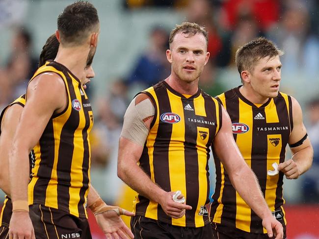 MELBOURNE, AUSTRALIA - APRIL 18: Tom Mitchell of the Hawks speaks with AFL Field Umpire, Hayden Gavine after a 50 metre penalty was awarded to Geelong during the 2022 AFL Round 05 match between the Hawthorn Hawks and the Geelong Cats at the Melbourne Cricket Ground on April 18, 2022 In Melbourne, Australia. (Photo by Michael Willson/AFL Photos via Getty Images)