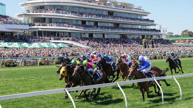 Knight's Choice holds off the rest of the field in front of a packed Flemington Racecourse. Picture: Getty Images