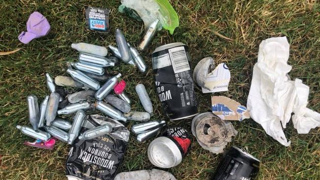 Some of the rubbish found at Fossil Beach, including discarded alcohol cans and ‘nangs’.