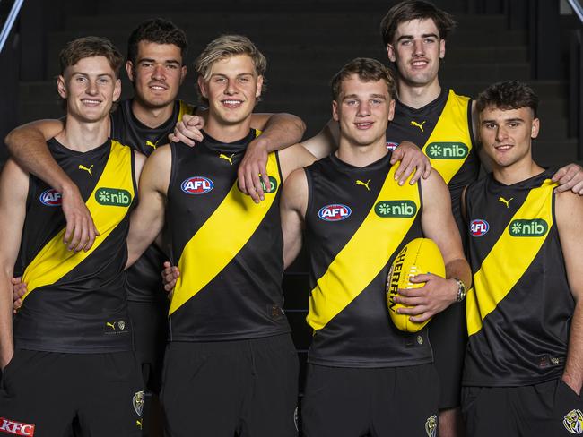 MELBOURNE, AUSTRALIA - NOVEMBER 21: Richmond draftees (L-R) Luke Trainor, Harry Armstrong, Josh Smillie, Sam Lalor, Jonty Faull and Taj Hotton pose for a photograph during the 2024 AFL Draft at Marvel Stadium on November 21, 2024 in Melbourne, Australia. (Photo by Daniel Pockett/Getty Images)