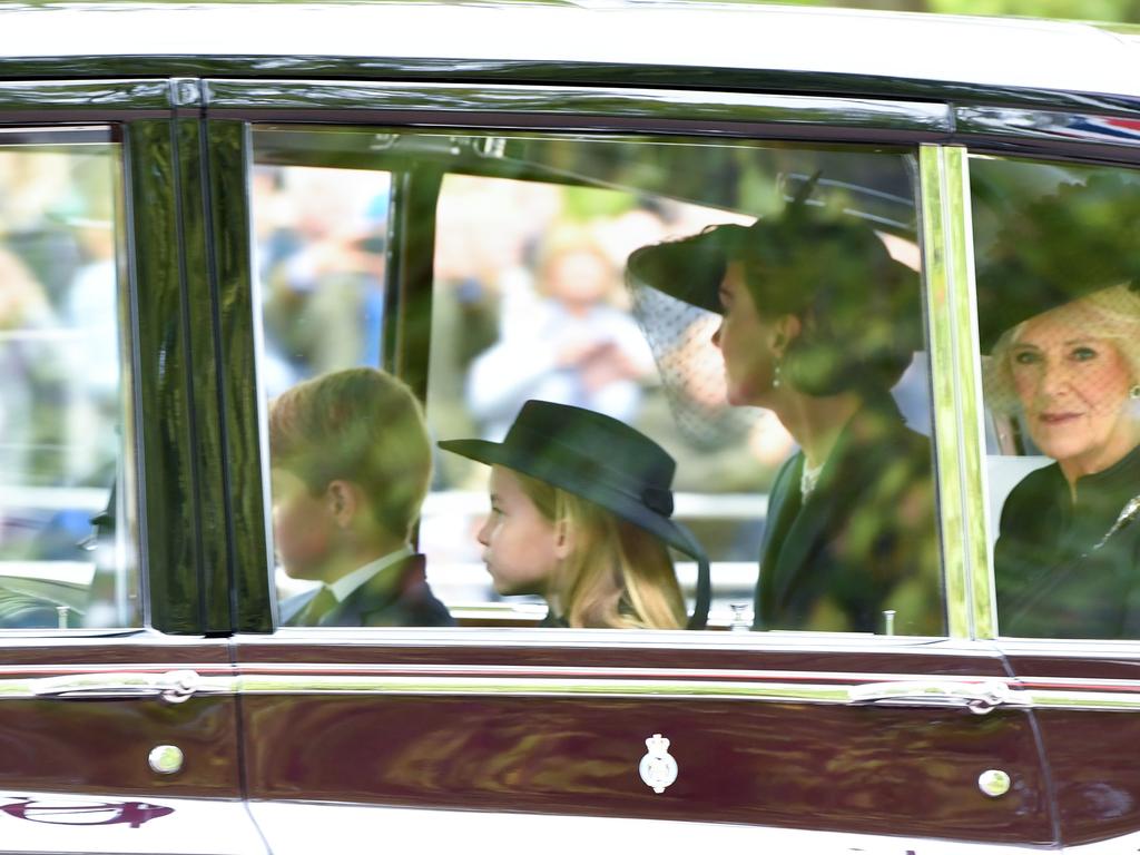 Princess Charlotte of Wales, Prince George of Wales, Catherine, Princess of Wales and Camilla, Queen consort are seen on The Mall.