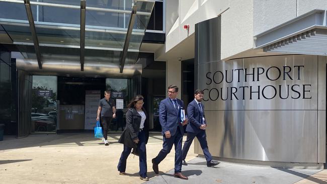 Eva Malandris (left) leaves Southport court.