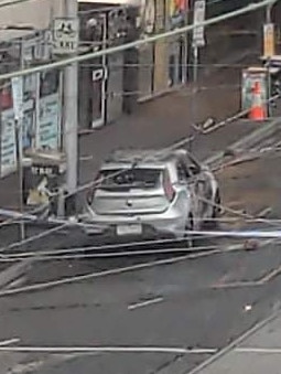 The charred remains of the car on Church St.