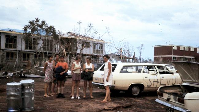 The point of operations after the cyclone. Pictured behind is what remained of Ruth and Graham White's hostel, which would later house the Morris family through 1975. Depicted are Helen White, Carol Brown (cousin), Duncan Morris, Winsome Merrett, Valerie Barker, and Wilga Morris. Picture: Supplied