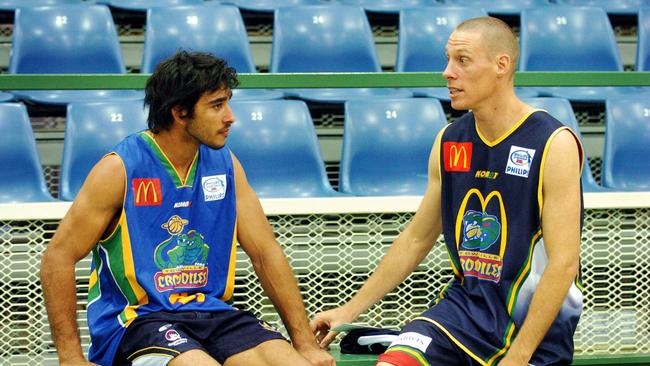 26 JUL 2005 - Former Brisbane Bullet John Rillie talks with Johnathan Thurston (left) at Nth Qld Cowboys training at Townsville Crocodiles facilities - PicCameronLaird
