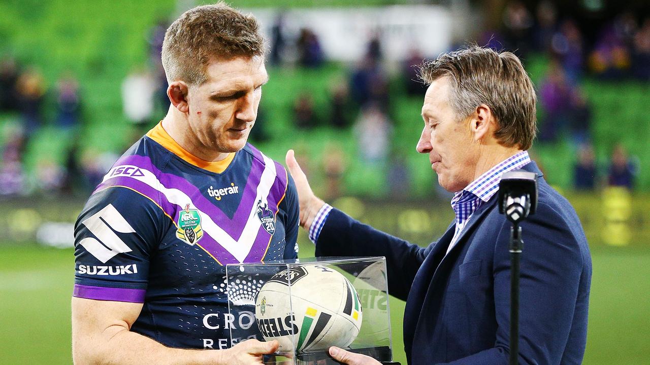 Craig Bellamy presents Ryan Hoffman with the match ball by Storm head coach Craig Bellamy after his last home and away match. (Photo by Michael Dodge/Getty Images)