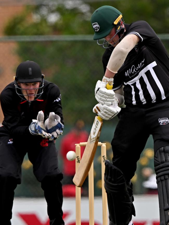 Essendon wicketkeeper Oliver Willett watches Camberwell’s Coby Fitzsimmons get one away. Picture: Andy Brownbill