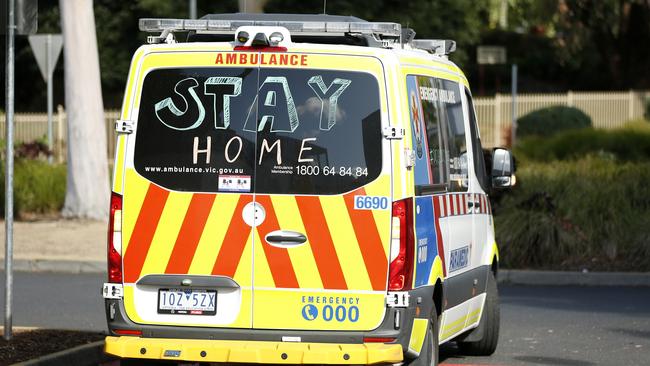 An ambulance with a message encouraging people to stay home. Picture: Darrian Traynor/Getty Images