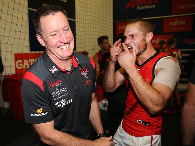 A happy John Worsfold celebrates with Bombers star David Zaharakis. Picture: Getty Images