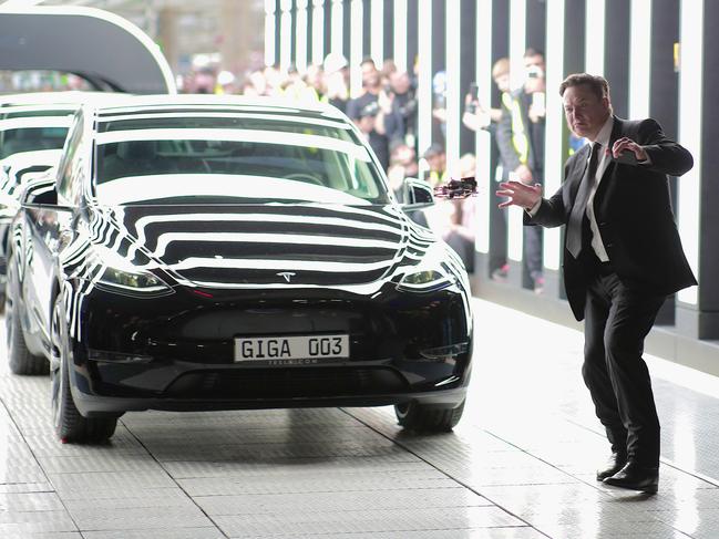 GRUENHEIDE, GERMANY - MARCH 22:  Tesla CEO Elon Musk attends the official opening of the new Tesla electric car manufacturing plant on March 22, 2022 near Gruenheide, Germany. The new plant, officially called the Gigafactory Berlin-Brandenburg, is producing the Model Y as well as electric car batteries. (Photo by Christian Marquardt - Pool/Getty Images)