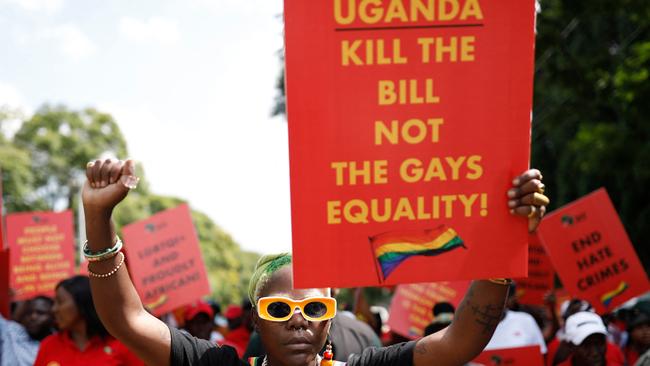 Uganda’s queer activist Papa De raises her fist outside the Uganda High Commission in Pretoria during a picket against the country’s anti-homosexuality bill. Picture: Phill Magakoe/AFP