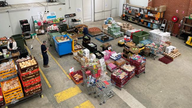 Staff at the Geelong Food Relief Centre prepare donated food at the company's North Geelong warehouse. Photo: Mark Murray