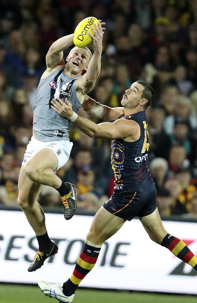 Marking in front of Adelaide co-captain Taylor Walker in this year’s Showdown. Picture: Sarah Reed.