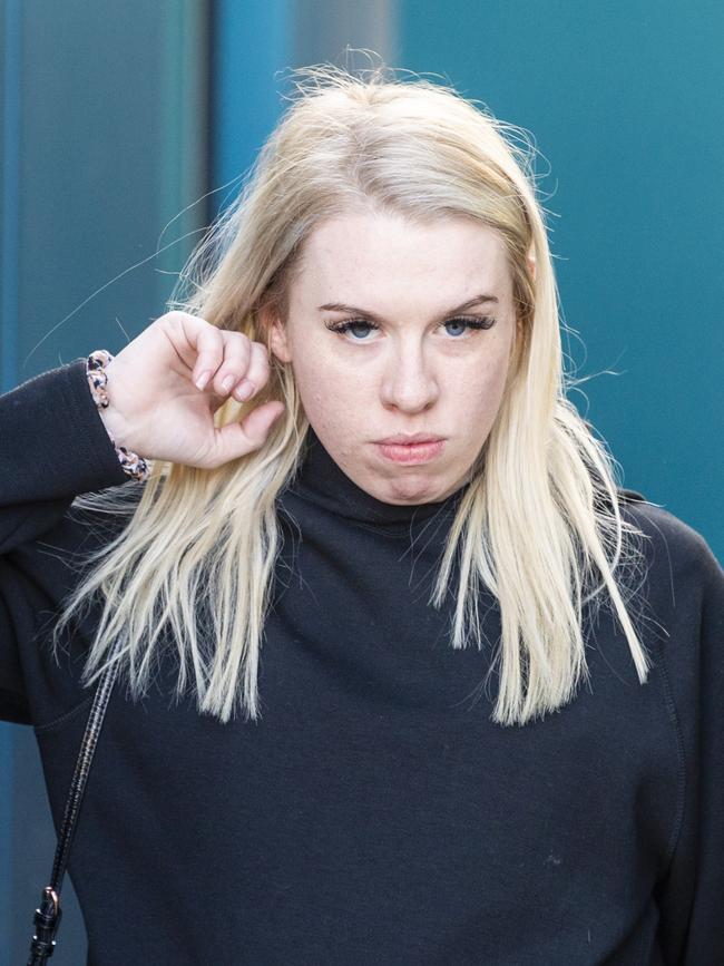 Isobel Rose Higgins, 24, leaves the Toowoomba Watch House after being charged with being an accessory after the fact of murder of Thor Morgan, Thursday, August 18, 2022.