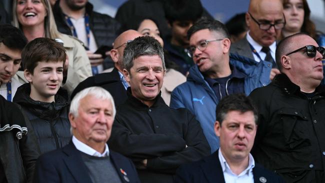 Musician Noel Gallagher with son Donovan at a football match last year. Picture: AFP.