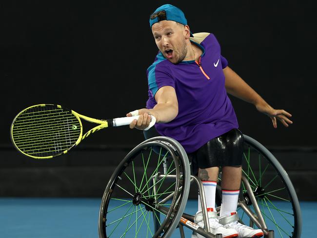 MELBOURNE, AUSTRALIA - FEBRUARY 17:  Dylan Alcott of Australia plays a forehand in his Quad Wheelchair SinglesÃÂ Final match against Sam Schroder of the Netherlands during day 10 of the 2021 Australian Open at Melbourne Park on February 17, 2021 in Melbourne, Australia. (Photo by Mark Metcalfe/Getty Images)