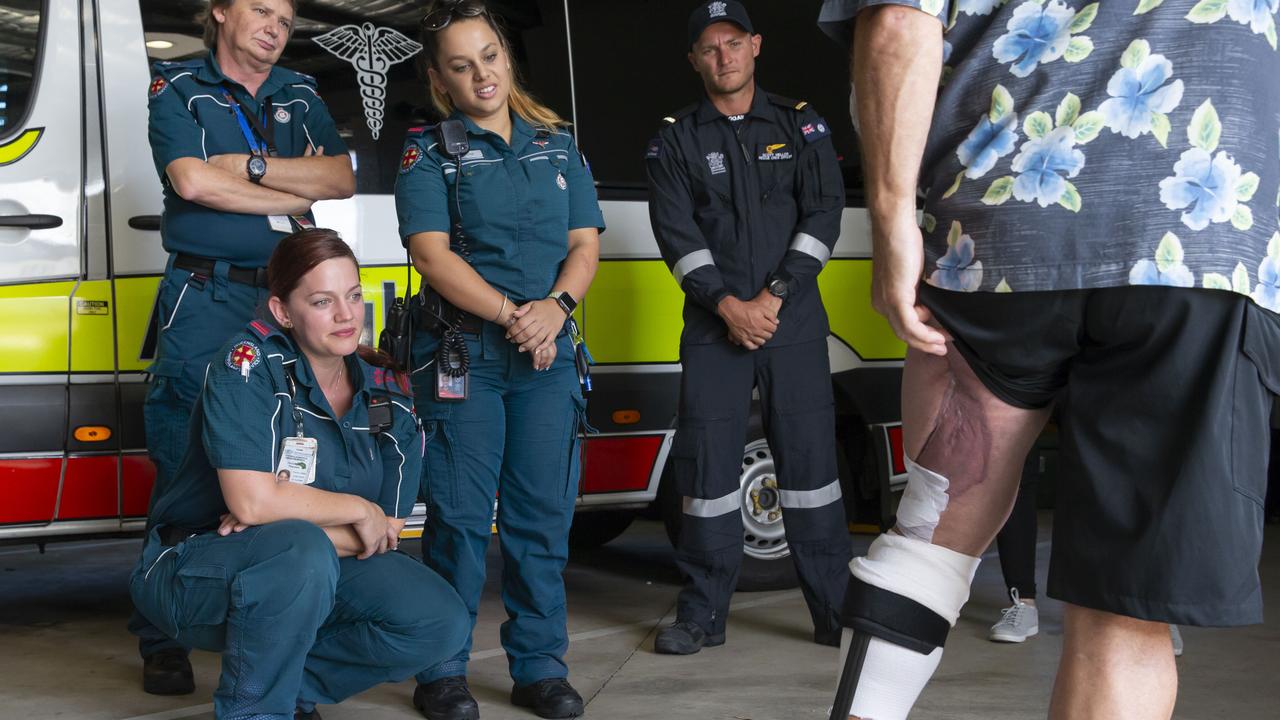 Shark attack survivor Rick Bettua show his injuries to the emergency workers who saved his life after his release from hospital where he underwent over 30 surgeries and skin grafts to save his leg. Picture: Lachie Millard