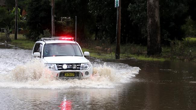 A flooded street in Chipping Norton as emergency services attempt to mop. Picture: Stephen Cooper