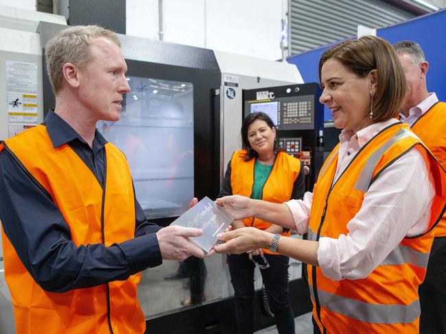 Then-Queensland opposition leader Deb Frecklington is presented with a plaque from Gilmour Space CEO Adam Gilmore which reads Let’s Get Queensland working again. Picture: NCA NewsWire / Sarah Marshall