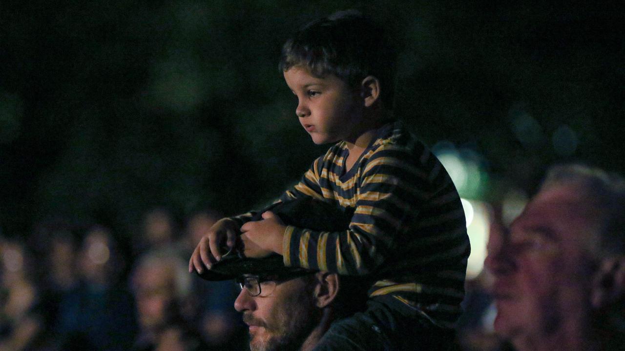 Wes Innes and his son Zan 4 at The Dawn Service at Darwins Cenotaph commemorating ANZAC Day 2021. Picture Glenn Campbell