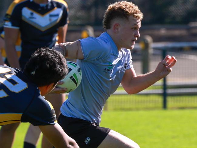 Diminutive hooker Lachlan Simpson skips away. Pic: Justin Lloyd.