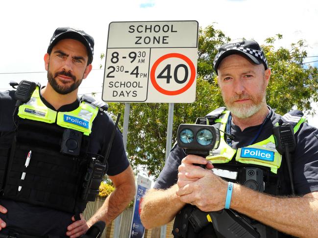 Geelong Highway Patrol Sergeant Damon Patralakis, left, and acting Sergeant Jamie Davidson patrolling 40kmh school zones. Picture: Alison Wynd