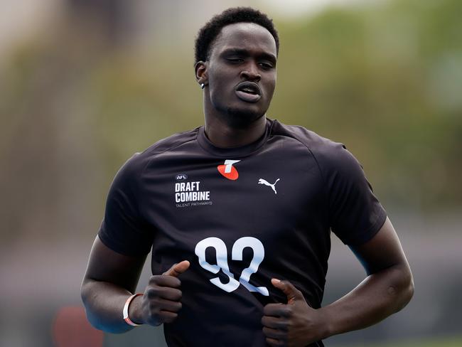 MELBOURNE, AUSTRALIA - OCTOBER 06: Ajang Kuol Mun (Victoria - Geelong Cats (VFL)) competes in the 2km time trial during the Telstra AFL State Draft Combine at MSAC on October 06, 2024 in Melbourne, Australia. (Photo by Dylan Burns/AFL Photos via Getty Images)