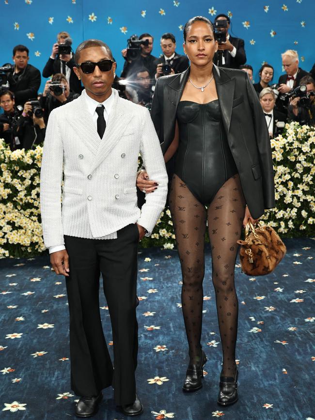 Pharrell Williams, Met Gala Co-Chair, and Helen Lasichanh attend the 2025 Met Gala Celebrating 