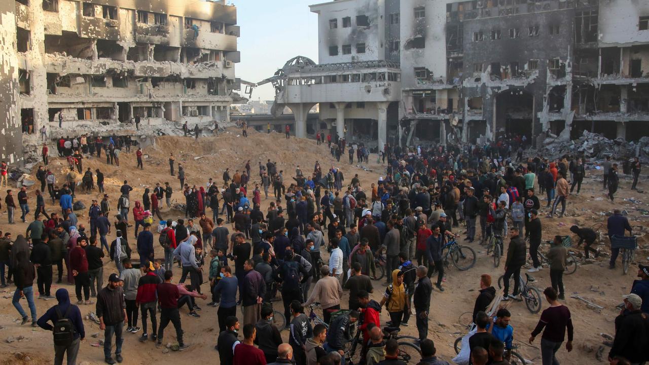 Palestinians inspect the damage at Gaza's Al-Shifa hospital. Picture: AFP