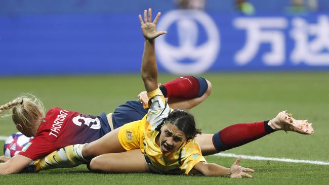 Australia's Sam Kerr, right, and Norway's Maria Thorisdottir fall during the Women's World Cup round of 16 soccer match between Norway and Australia at the Stade de Nice in France. Picture: AP