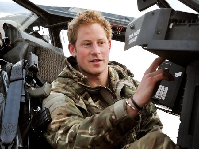 In this photo taken 12 Dec 2012, made available 21 Jan 2013 of Britain's Prince Harry or just plain Captain Wales as he is known in the British Army, makes his early morning helicopter pre-flight checks on the flight-line, from Camp Bastion southern Afghanistan. The Ministry of Defense announced Monday that the 28-year-old prince is returning from a 20-week deployment in Afghanistan, where he served as an Apache helicopter pilot with the Army Air Corps. (AP Photo/ John Stillwell, Pool)