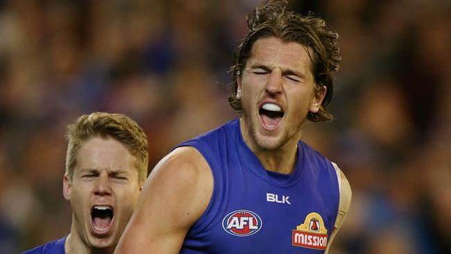 Marcus Bontempelli and Lachie Hunter celebrate a third-term goal. Picture: Wayne Ludbey