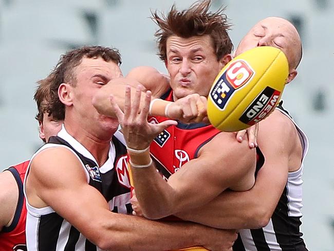 Saturday, 1st April, 2023 - SANFL Showdown. Port Adelaide v Adelaide Crows at the Adelaide Oval. Matt Crouch of the Crows gets tackled by Cameron Sutcliffe of Port Adelaide. Picture: Sarah Reed