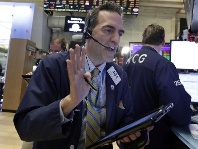 Trader Gregory Rowe works on the floor of the New York Stock Exchange, Wednesday, April 27, 2016. Stocks indexes are mostly lower in early trading as weakness in the technology sector pulls the broader market lower. (AP Photo/Richard Drew)