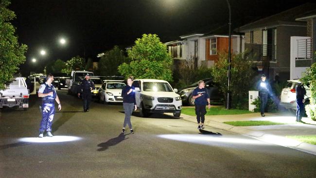Police at the scene of the stabbing. Two teens have been arrested. Picture: Steve Tyson