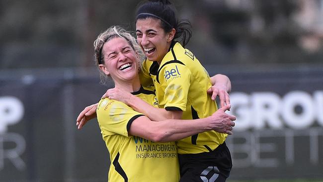 An airborne Belinda Pannella celebrates one of Leigh Gray’s many goals for Heidelberg United this season.  Picture:Rob Leeson.