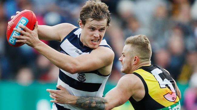 Jake Kolodjashnij breaks a Brandon Ellis tackle. Picture: Getty Images