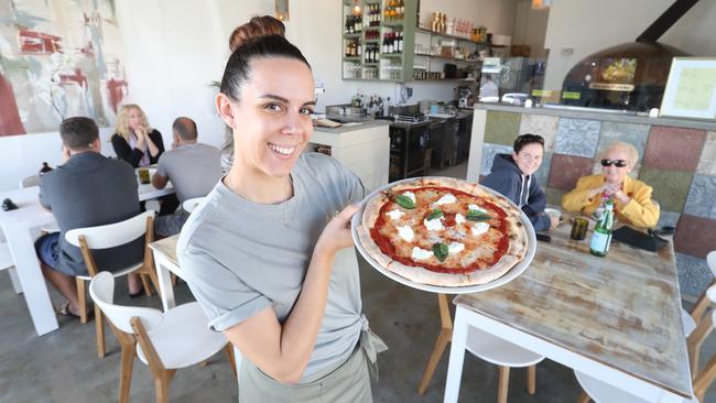 Anna Gazzola with a Rita pizza; tomato base, mozzarella and basil. Photo by Richard Gosling