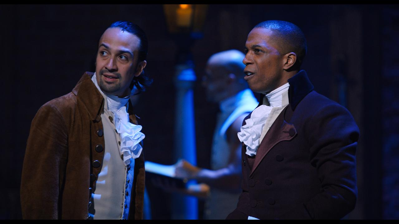 Lin-Manuel Miranda plays Alexander Hamilton alongside Leslie Odom, Jr. as Aaron Burr