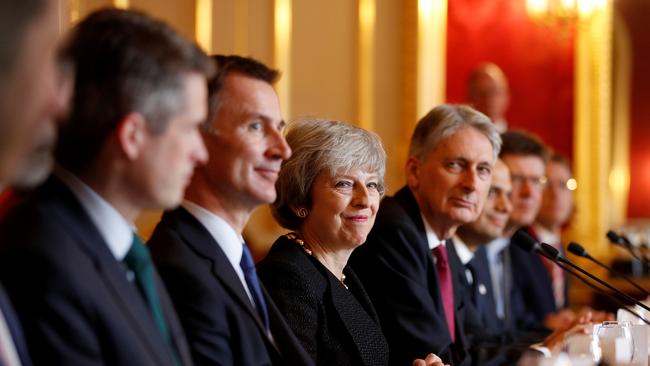 Smiling through the pain: Britain is twisting in the wind over Brexit. Picture: Getty Images.