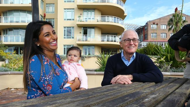 Leena Mathew, with nine-month-old daughter Lyla, meets Malcolm Turnbull in Sydney as he spruiks income-tax cuts. Picture: Britta Campion