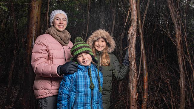 Eva Rudrup aged 12, Taj Rudrup aged 8 from Woodbridge and Emi Alexander aged 9 from Central Coast NSW were rugged up ready for a walk on Mount Wellington / kunanyi on Sunday 14th July 2024. Picture: Linda Higginson