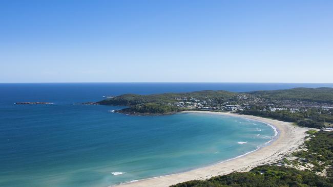 Top beaches in Australia. Coastal aerial of Fingal Beach in Fingal Bay, Port Stephens. Credit: ETHAN ROHLOFF