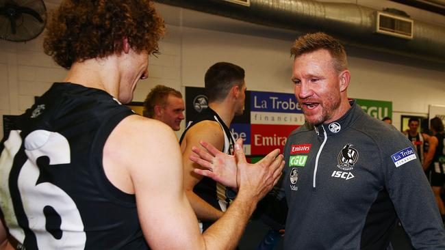Nathan Buckley celebrates the win with Chris Mayne.