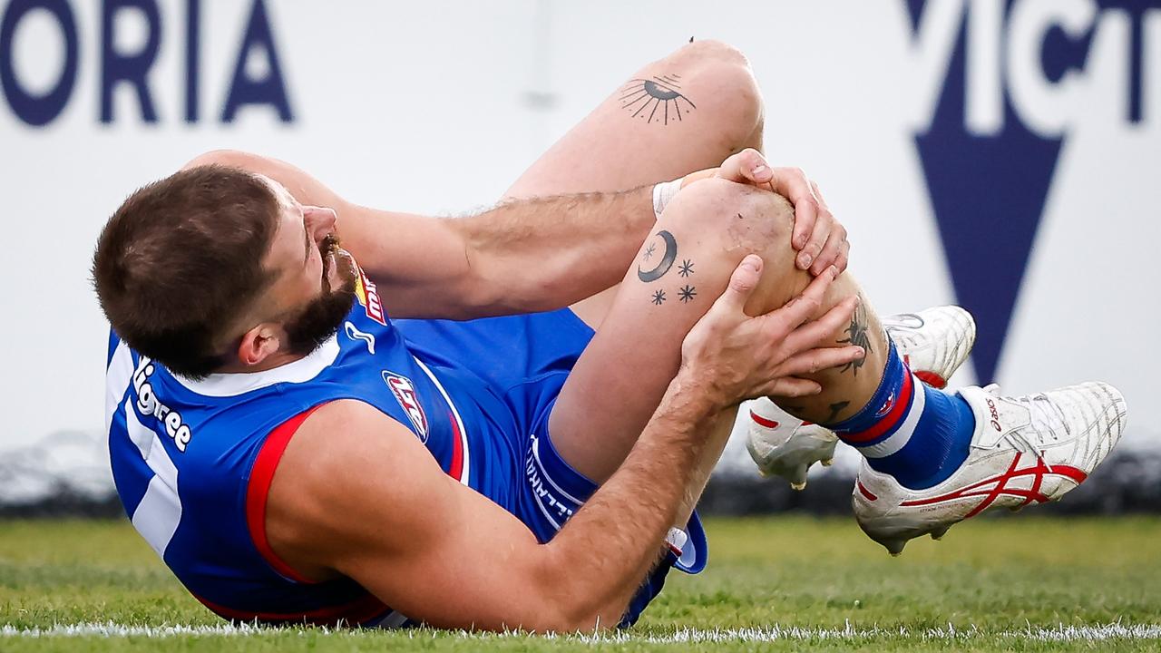 Bruce instantly clutched at his knee. (Photo by Dylan Burns/AFL Photos via Getty Images)