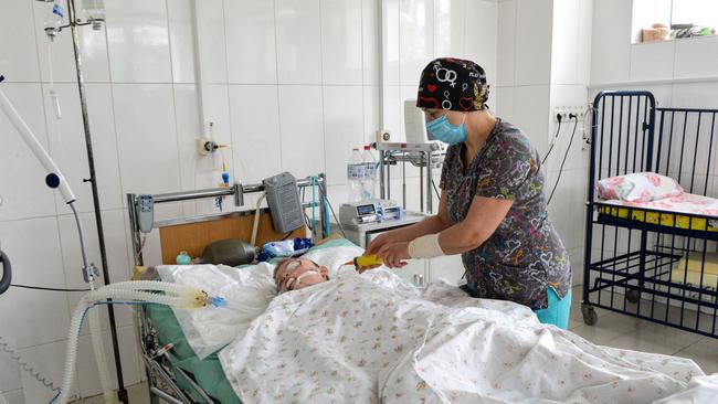 A doctor treats a boy, who was injured by the shelling in a hospital in Ukraine's second-biggest city of Kharkiv. Picture: Sergey Bobok / AFP