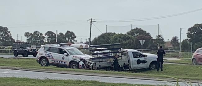 A police car was damaged and a man arrested after a suspected stolen ute's tyres were spiked near the intersection of Holts Rd and Mackay Bucasia Rd about 10.05am Wednesday. Picture: Melanie Whiting